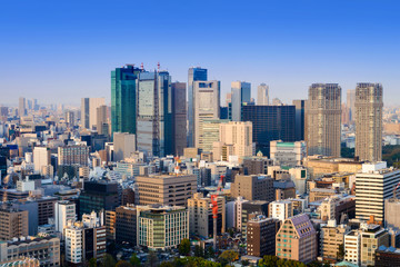  Landscape of tokyo city skyline in Aerial view with skyscraper, modern office building and blue sky background in Tokyo metropolis, Japan.