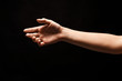 © Prostock-studio - Hand ready for handshake isolated on black