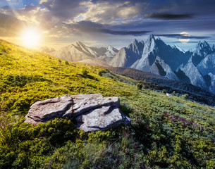 Wall Mural - time change concept over the composite landscape with meadow in rocky mountains. beautiful unrealist