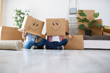 Funny Young Couple Enjoy And Celebrating Moving To New Home