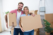 © didesign - Young couple holding and packing boxes for moving