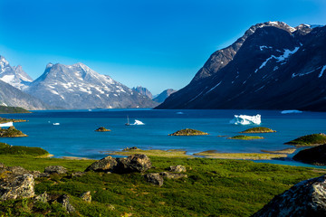 Wall Mural - greenlands fjord.yacht and iceberg. iceberg attacked the yacht.