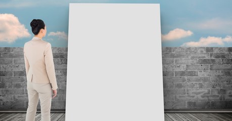 Poster - Businesswoman looking at white board