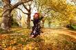 Women jumping in autumn Park, Colourful autumn fun