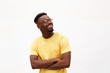 © mimagephotos - handsome young black man smiling with glasses against white background