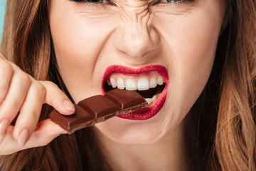 Canvas Print - Close up portrait of a furious brown haired woman