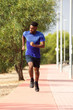 © mimagephotos - healthy young african man running outside