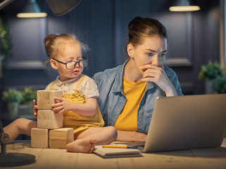 mother with toddler working