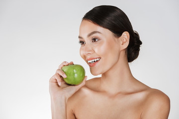 Canvas Print - Beautiful young woman with apple.