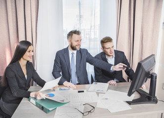 Wall Mural - three businessmen at the meeting to communicate