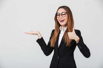 Poster - Portrait of a happy businesswoman dressed in suit