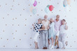 Older people with balloons