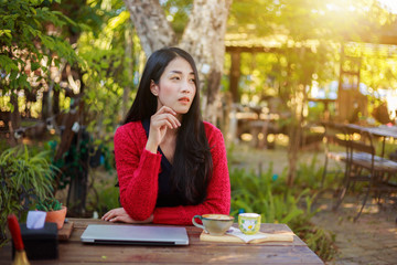 Sticker - portrait of woman with laptop and coffee in the garden