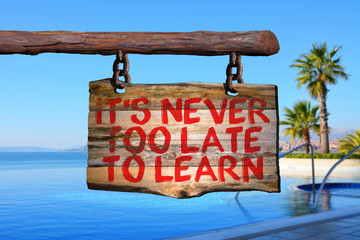 Wall Mural - It's never too late to learn motivational phrase sign
