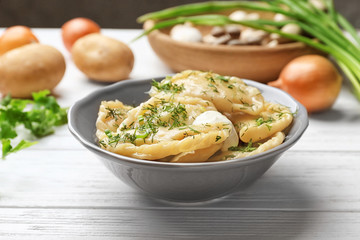 Poster - Bowl with tasty dumplings on table