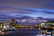 View from Tower Bridge on London Cityscape panorama at sunset with HMS Belfast in the foreground, and London Bridge