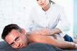 © JackF - Relaxing professional massage for young man in spa salon