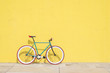 © 2Design - A City bicycle fixed gear on yellow wall