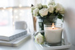 © Daria Minaeva - White room interior decor with burning hand-made candle and bouq