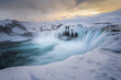 © PhotographingIceland - Scenic view of Godafoss waterfall in winter