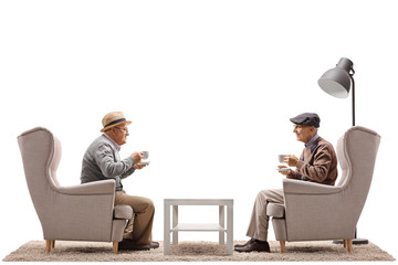 Wall Mural - Elderly men with cups sitting in armchairs