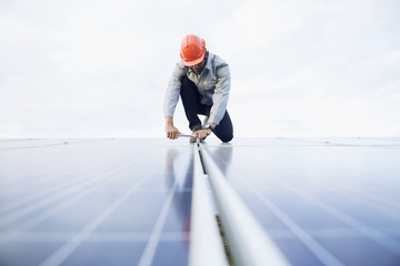 engineer working on checking and maintenance equipment at industry solar power.