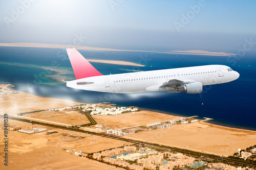 Zdjęcie XXL Samolot chmury góry czerwony tło podróży transportu