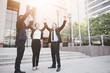 © khwanchai - Hand coordination of team businessman on sky infront of bank building, office after successful project.