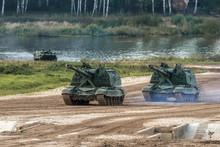 Army Tanks Crossing River During Summer Military Training Exercices
