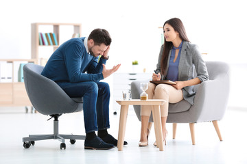 Female psychologist with patient in office