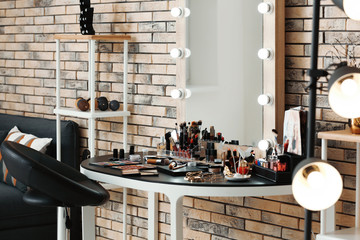 Poster - Decorative cosmetics and tools on dressing table in makeup room