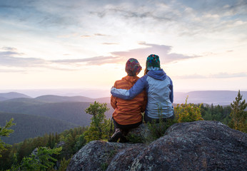 Couple Watching Sunset Mountain Outdoors Concept