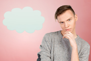 Portrait of handsome young thoughtful man