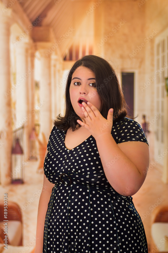 Close up of a surprised fat woman in a beautiful dress, in blurred  background Stock Photo | Adobe Stock