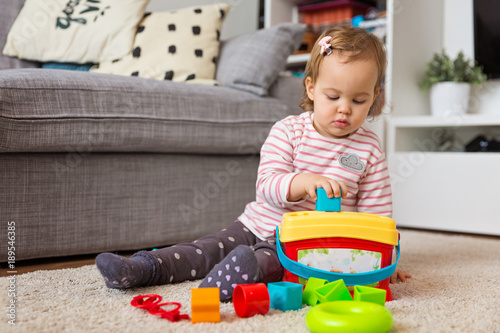baby toy shapes in holes