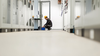 Wall Mural - maintenance engineer inspect system with relay test set equipment