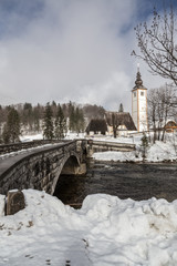 Canvas Print - View on the church and bridge of lake Bohinj