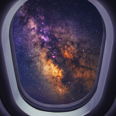 Wall Mural - airplane is flying at night. space milky way view from plane window. dark clear starry sky