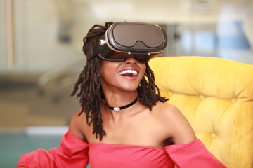 Wall Mural - Joyful black female enjoying virtual reality