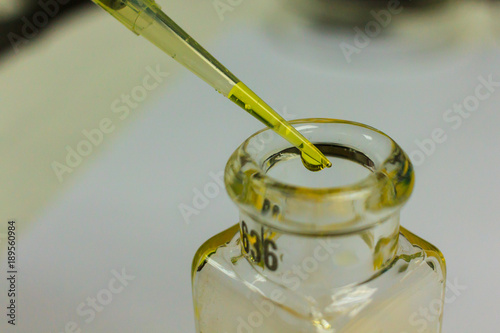 Download Yellow Chemical Transparent Liquid In Pipette Tip Dropping To Clear Sample Bottle During Experiment Of Chemistry In Laboratory Buy This Stock Photo And Explore Similar Images At Adobe Stock Adobe Stock Yellowimages Mockups
