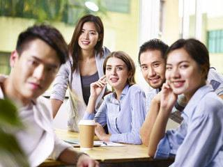 Wall Mural - Portrait of business people looking at camera and smiling