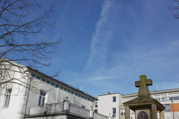 Wall Mural - roofs with chimney and aerials on top of historical facades