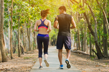 Wall Mural - Couple runner working on exercise and warm up to jogging and running outdoors in nature.