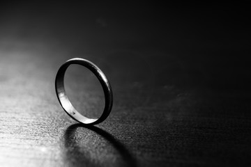 Silver ring on black background