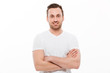 © Drobot Dean - Young happy man standing isolated