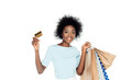young happy woman with shopping bags and credit cardisolated on white