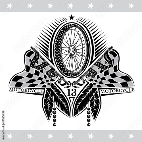 Fotografía Motorbike wheel between crossed raced flags and indian feather