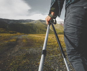 Wall Mural - Traveler Man With Trekking Poles, Rear View Closeup. Tourism Lifestyle Mountains Concept