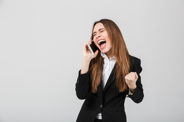 Poster - Happy lady screaming and showing winner gesture isolated