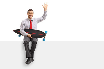 Poster - Businessman with a longboard sitting on a panel and waving